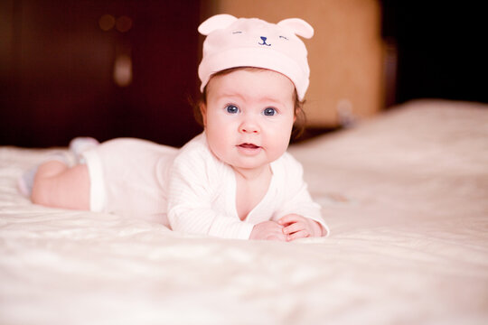  baby in a hat bearhat 
baby, child, newborn, childhood, kid, face, hat, infant, boy, adorable, eyes, small, pink, toddler, cute, little, beauty, funny, smile, person, happiness, sweet, innocence, ex