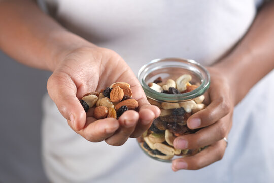  Young Man Eating Many Mixed Nuts 