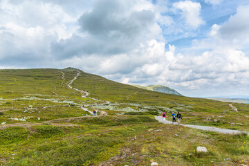 Mountain plateau with people wandering