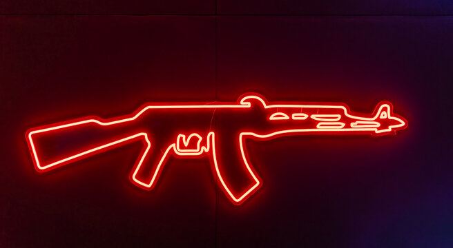 recommend clip art: Glowing neon line weapon gun icon isolated on blue background