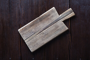 Empty cutting board on wooden brown background. copy space for text