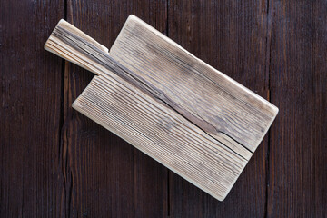 Empty cutting board on wooden brown background. copy space for text