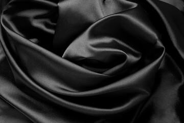 Fototapeta premium Textile background. Black silk. Copy space. Close-up.