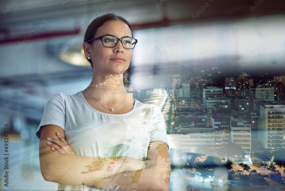 Canvas Prints Taking the city by storm. Multiple exposure shot of a young businesswoman superimposed over a city background at night.