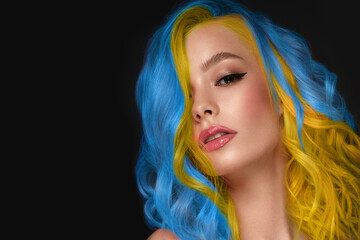 Beautiful woman with blue and yellow hair and classic make up and hairstyle. Beauty face.