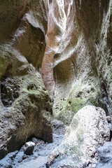 Panorama of the narrow mountain Karadakh gorge with sunlight in Dagestan. Russia June 2021.