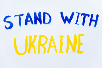 Top view of painted stand with ukraine lettering on white background.