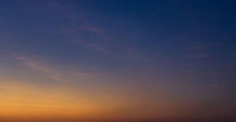 Naklejka na ściany i meble Evening sky with colorful orange sunset clouds on twilight, Dusk sky background