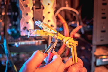 Cutting the Internet cable tied into a knot with wire cutters. Disconnecting the Internet and restricting access.