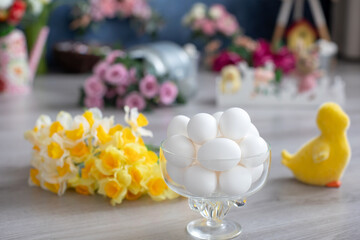 White eggs in a ball and yellow ducks in the background, Easter decoration - Powered by Adobe