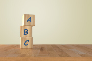 3d render wooden cubes with ABC on grey background 