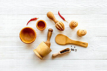 Flat lay of wooden kitchen utensils and cookware