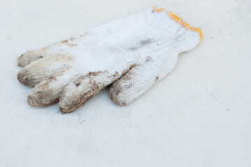 Dirty hand gloves using for work made of fabric on white background