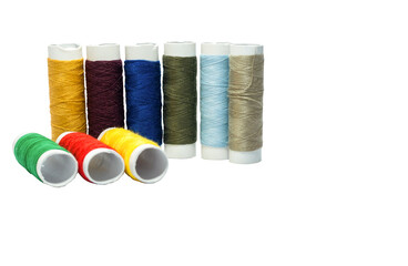 Colorful a lot of cotton yarns on rolls for sewing. Knitting yarn for handmade of clothes.Isolated on white background.
