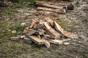 Fototapeta na wymiar Pile of wood logs for build Furniture production,sew natural wood scraps, ready to recycle