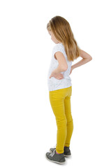 Back view of little girl looking at wall. Rear view. Isolated on white background 