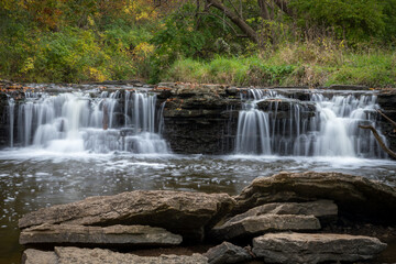 Beautiful fall leaves surround waterfall runoff at Waterfall Glen Forest Preserve, Dupage County, IL.