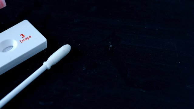 Negative Covid-19 test kit on black background 