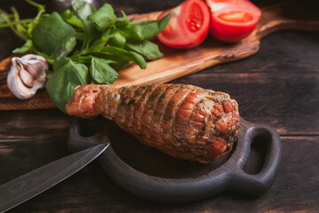 Artisan ham made from turkey meat, boiled and smoked with the addition of chicken fillet. Still life with ham in the form of a turkey leg