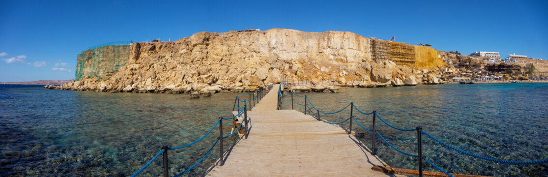 Panoramic view from the bridge to the ruined beach in the city of Sharm El Sheikh.