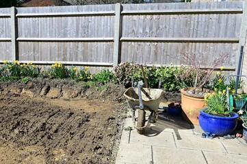 Landscape gardening tools and earth in an English garden.  