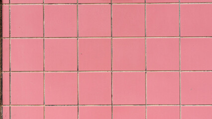 Pared de azulejos cuadrados rosa