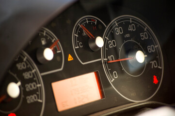 Fototapeta premium Speedometer close up over a black background.