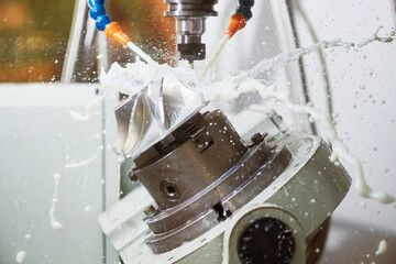 CNC milling machine work. Coolant and lubrication in gear metalwork industry