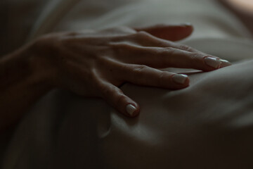 Close-up of a woman's hand. Gentle and sensual movement. Female attractiveness and temptation. Soft...