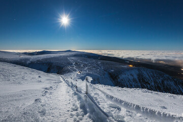 Winter view of the Meteorological Observatory on Śnieżka in the Karkonosze Mountains. The night...