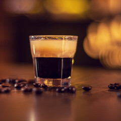 coffee shot on wooden bat table close up square
