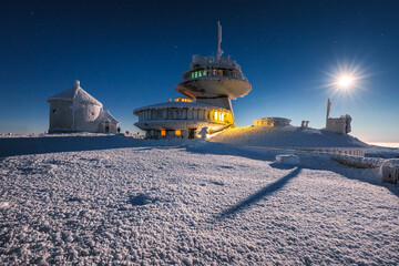 Winter view of the Meteorological Observatory on Śnieżka in the Karkonosze Mountains. The night...