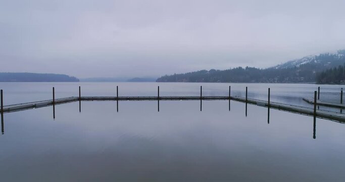 Winter aerial footage of Hayden Lake and lake homes with docks