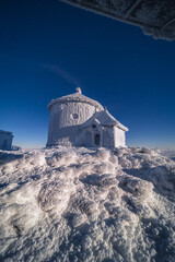 St. Lawrence Chapel on the top of Śnieżka in the Karkonosze Mountains. Winter view of the...
