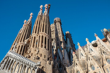 Below View of Sagrada Fam&iacute;lia with Blue Sky in Barcelona. Architecture of Minor Basicila in Eixample, Catalonia.