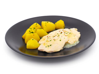 Scaloppine chicken breast with potatoes isolated on white background