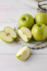 green delicious apples on a plate