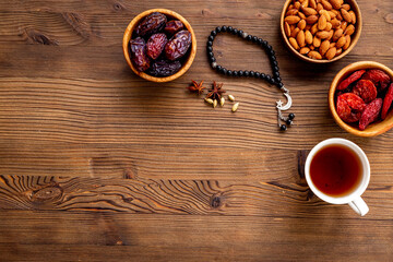 Islamic rosary with dates and tea. Ramadan Kareem concept.