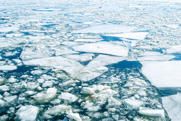 Cracked ice on surface of the Ocean, concept picture about Climate change in the World
