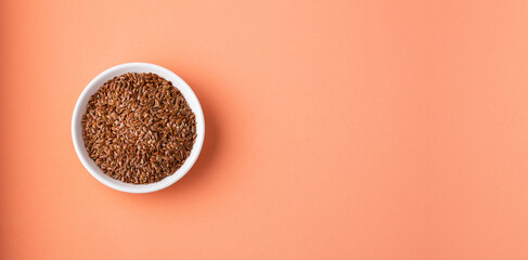 Linum usitatissimum - Organic flax seeds in the wooden bowl