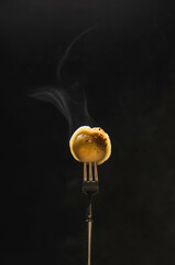 russian dumplings on a fork with steam