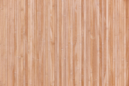 Striped artificial wooden panel background. Textured decorative laminate surface