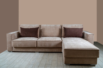 The interior, a beautiful gray sofa against the background of the bodily wall