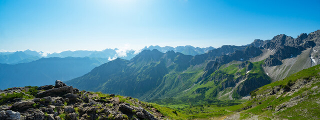 Kleinwalsertal alps mountains landscape panorama background - Mountain panorama in summer with blue...