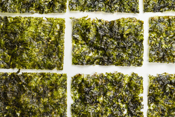 Tasty nori seaweed isolated on white. © Nikolay