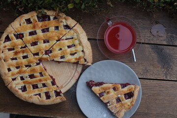 Apple pie cake with cherry with tea in plate dessert menu background 