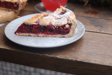 Apple pie cake with cherry with tea in plate dessert menu background 