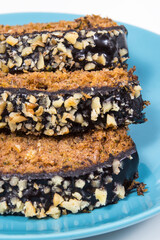 Homemade pastry made of zucchini with nuts and raisin. White background