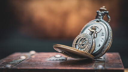 Watch Necklace On Old Book