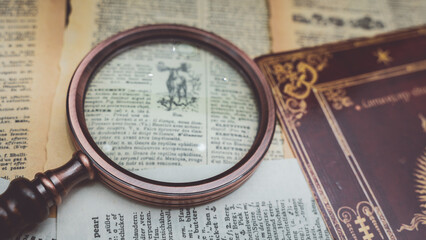 Magnifying Glass On Old Book